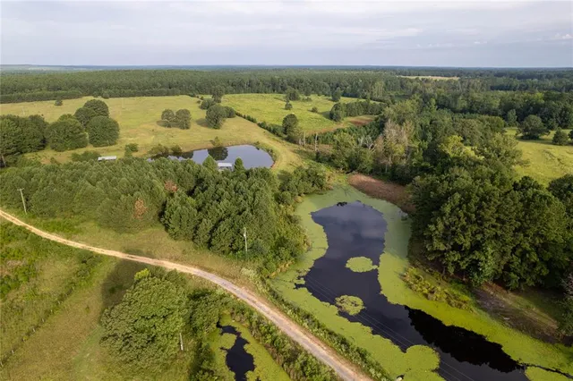 a view of a lake with a yard