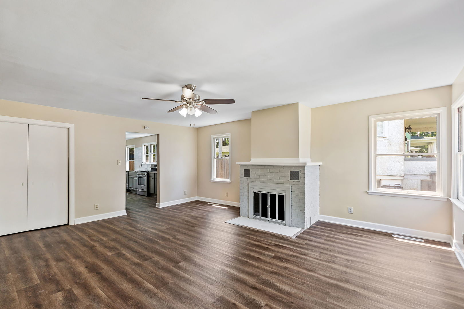 467 North Spring Street Elgin, IL 60120 - Photo 3 of 18 an empty room with windows and fireplace