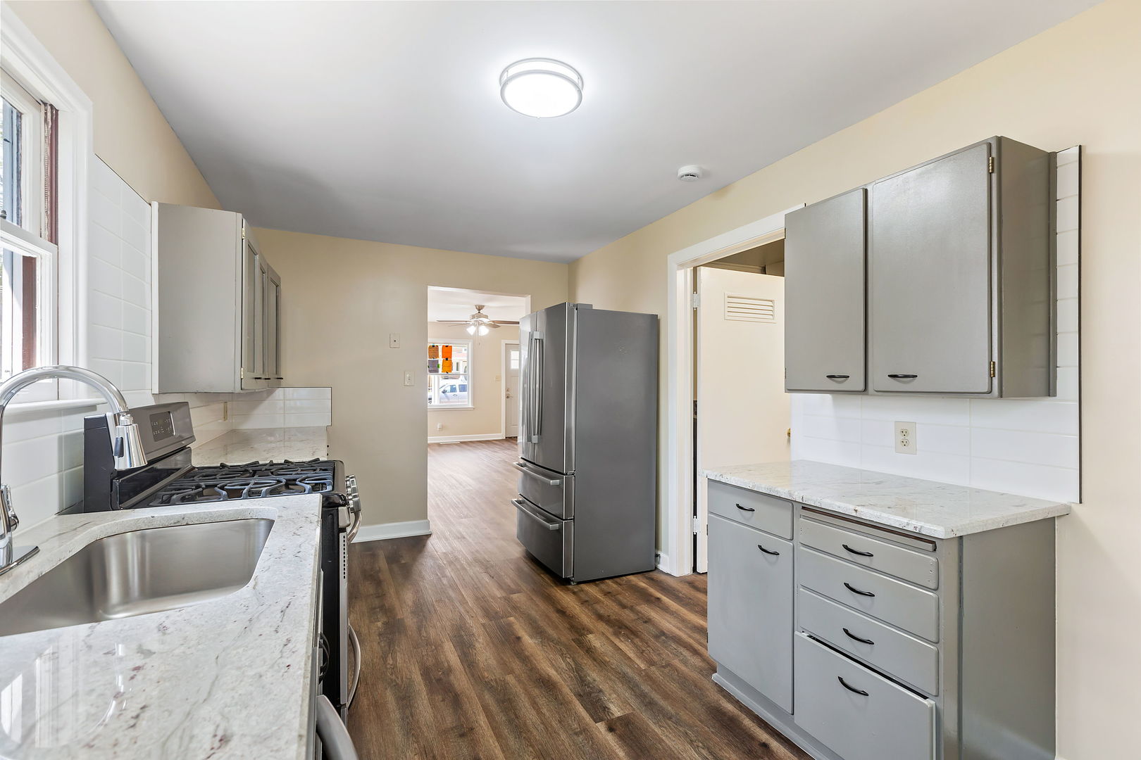 467 North Spring Street Elgin, IL 60120 - Photo 8 of 18 a kitchen with cabinets stainless steel appliances a sink and a counter space