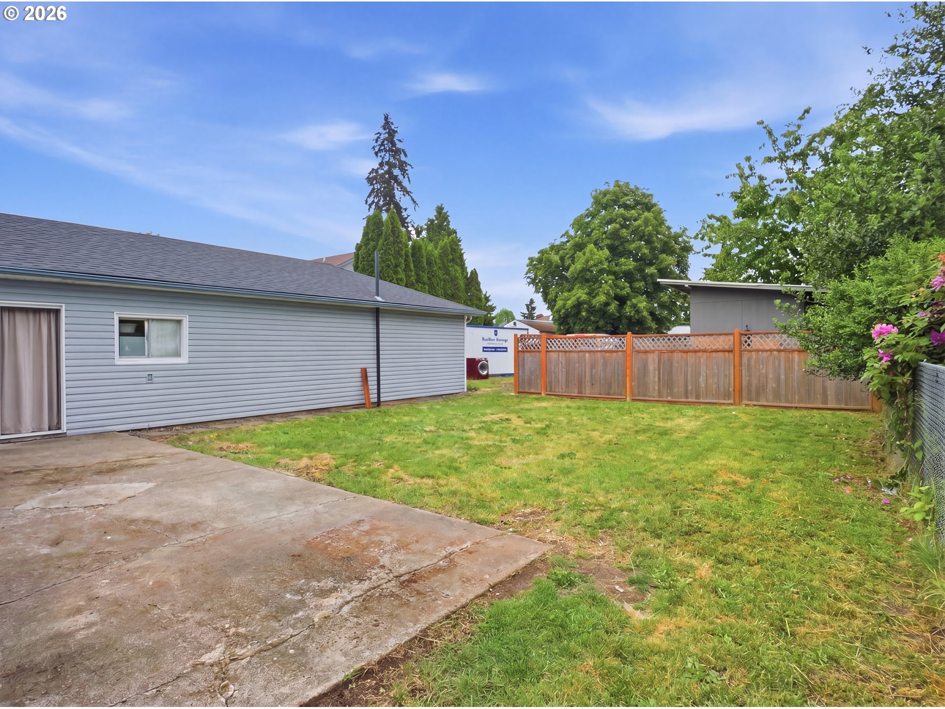 1357 Grove Street Lebanon, OR 97355 - Photo 28 of 37 a backyard of a house with lots of green space