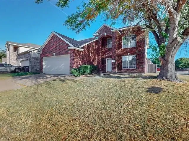 a view of large house with a yard
