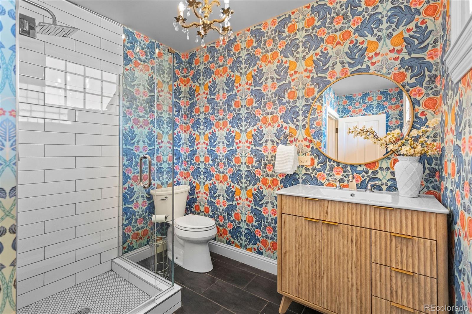 1389 Stuart Street Denver, CO 80204 - Photo 15 of 50 a bathroom with a toilet and a shower curtain