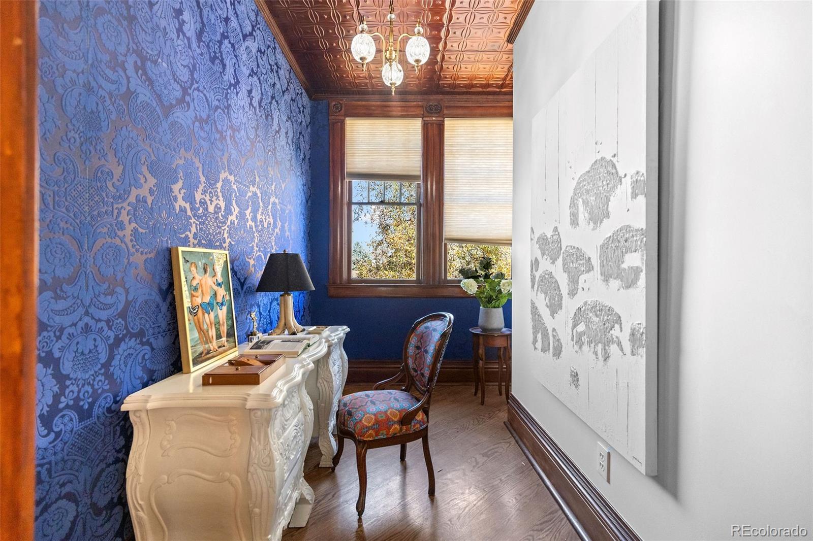 1389 Stuart Street Denver, CO 80204 - Photo 20 of 50 a dining room with furniture a chandelier and wooden floor