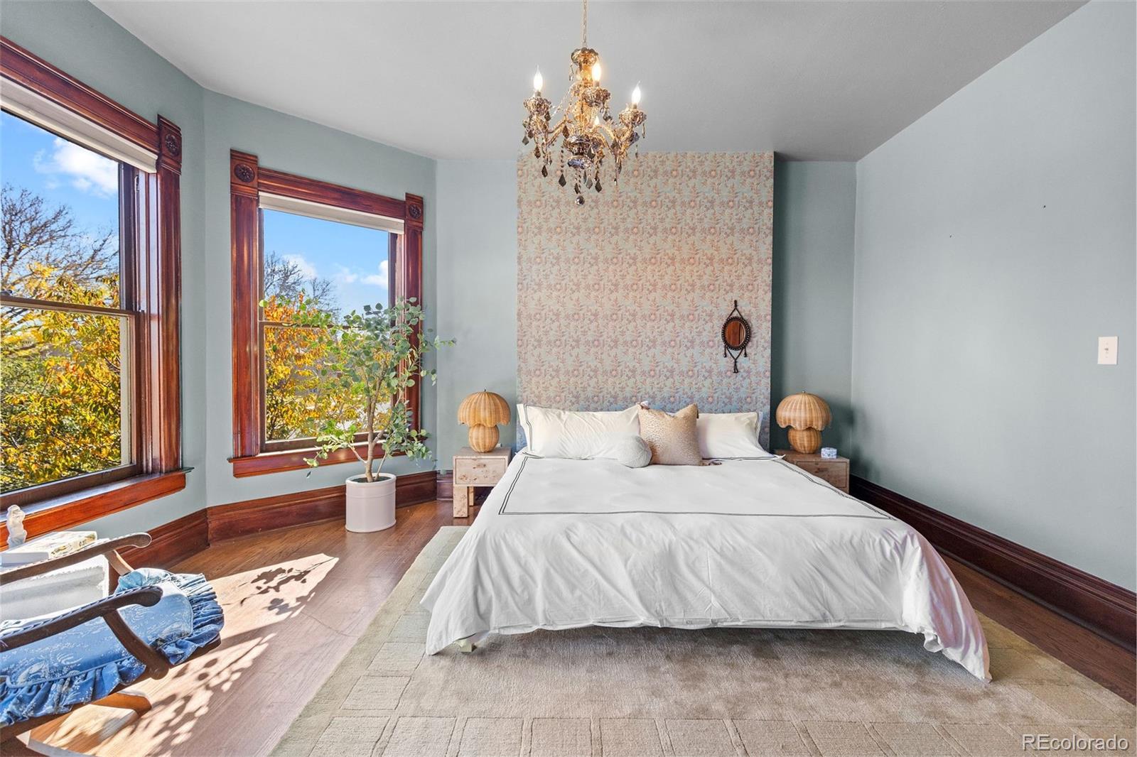 1389 Stuart Street Denver, CO 80204 - Photo 22 of 50 a bedroom with a large bed and a window