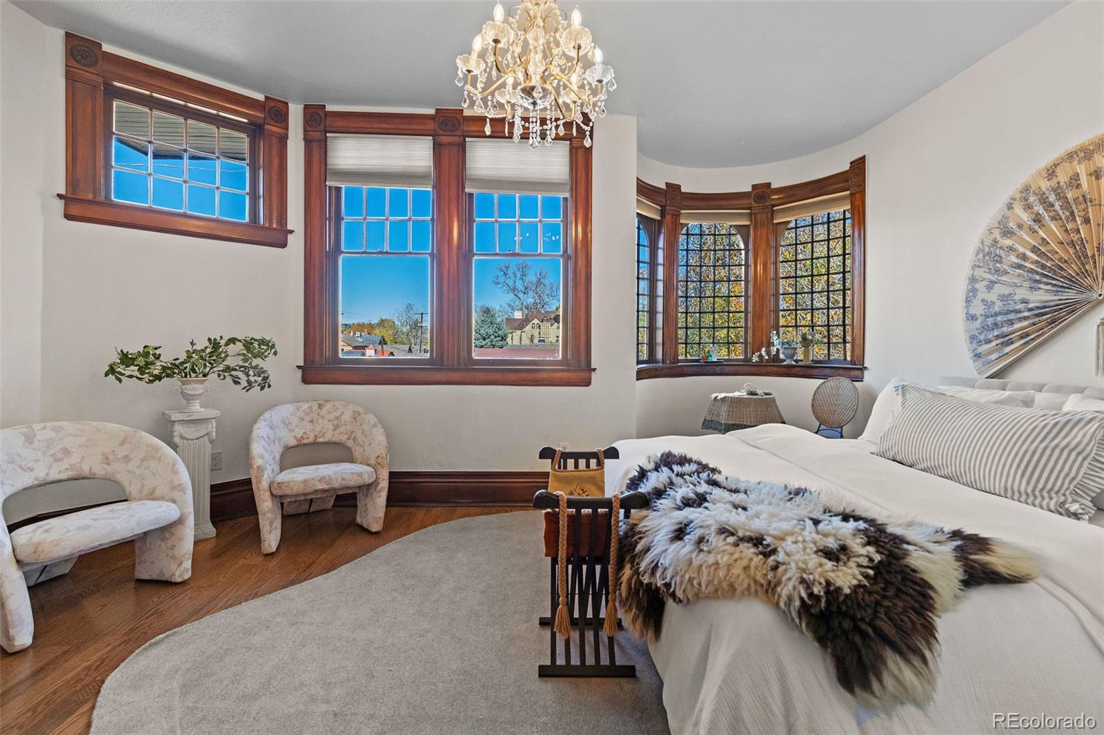 1389 Stuart Street Denver, CO 80204 - Photo 27 of 50 a view of a bedroom with furniture and windows