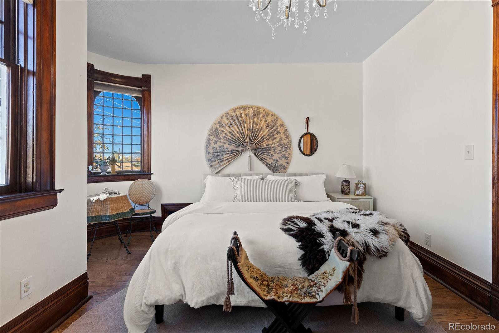 1389 Stuart Street Denver, CO 80204 - Photo 28 of 50 a bedroom with a bed and a painting on the wall