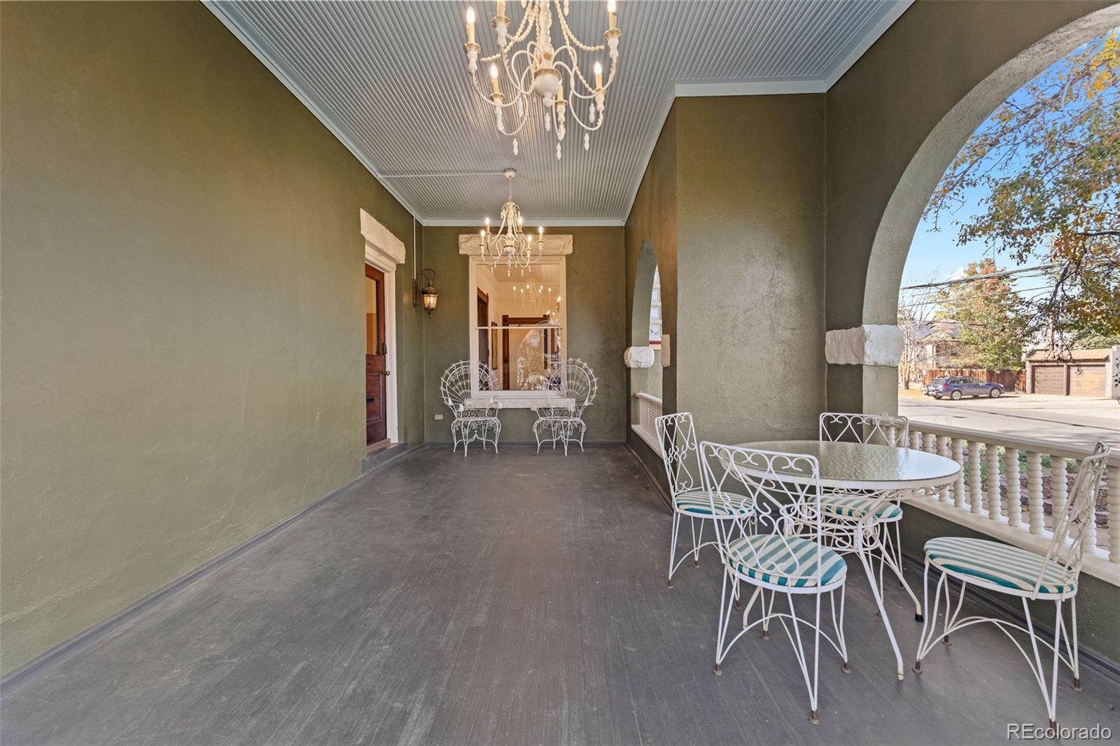 1389 Stuart Street Denver, CO 80204 - Photo 3 of 50 a view of a dining room with furniture and a chandelier