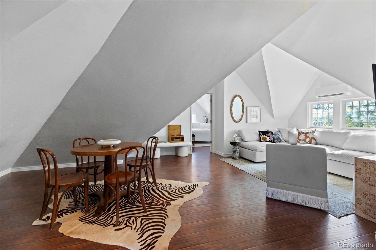 1389 Stuart Street Denver, CO 80204 - Photo 37 of 50 a living room with furniture and wooden floor
