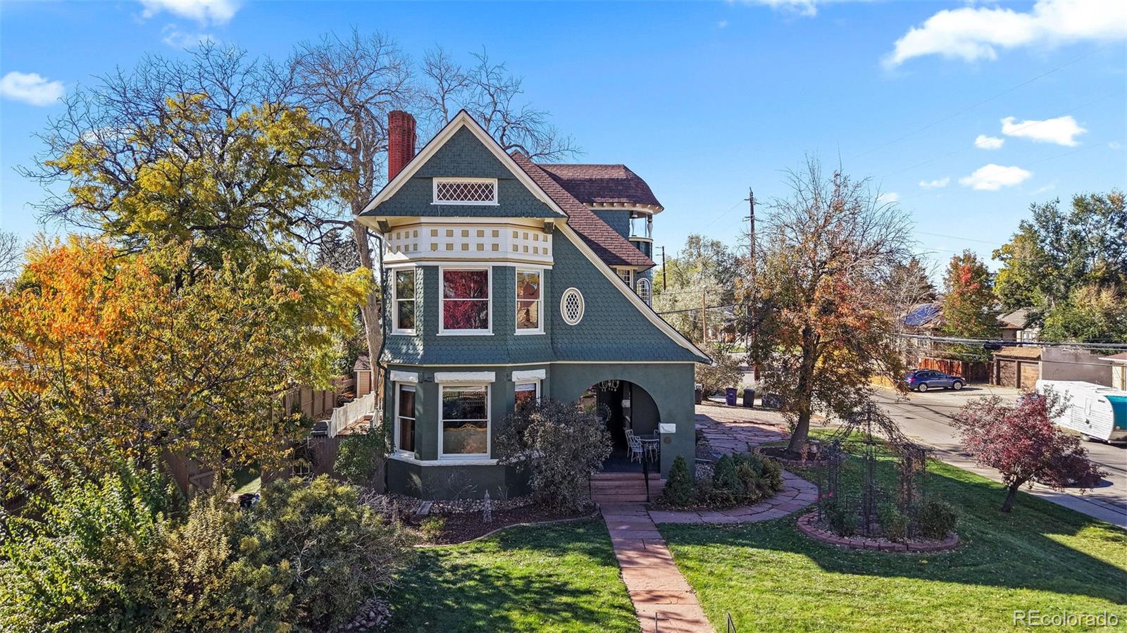 1389 Stuart Street Denver, CO 80204 - Photo 48 of 50 a front view of a house with garden