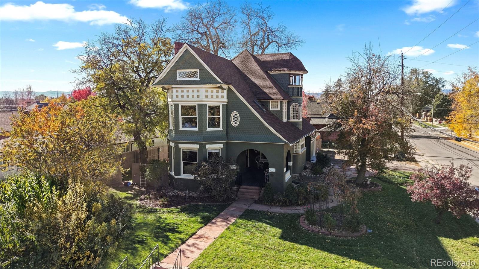 1389 Stuart Street Denver, CO 80204 - Photo 49 of 50 a front view of a house with a yard