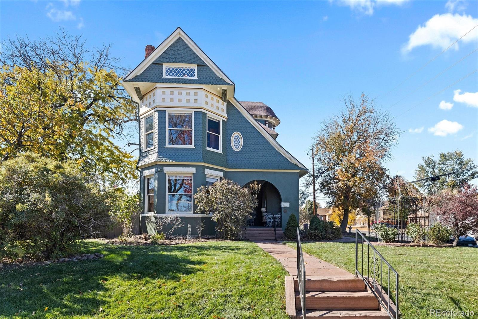 1389 Stuart Street Denver, CO 80204 - Photo 50 of 50 a front view of a house with a yard