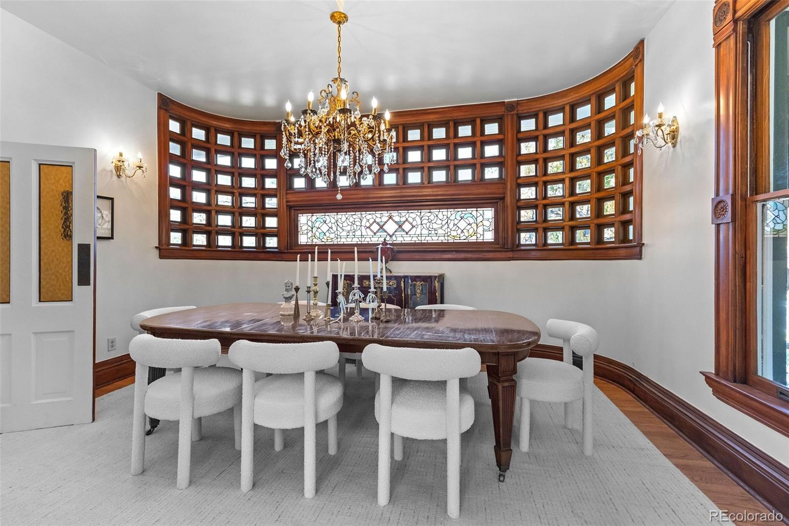 1389 Stuart Street Denver, CO 80204 - Photo 9 of 50 a view of a dining room with furniture and chandelier