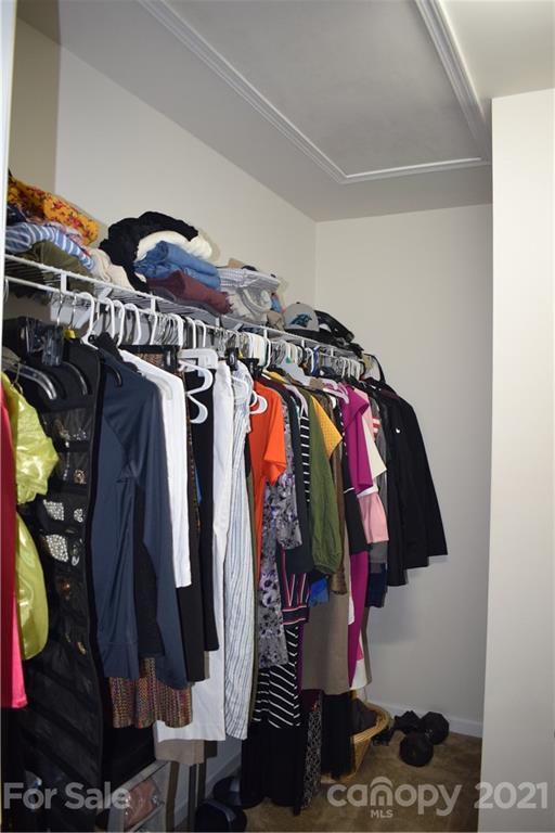 12021 Bending Branch Road Charlotte, NC 28227 - Photo 12 of 16 a close up view of a walk in closet