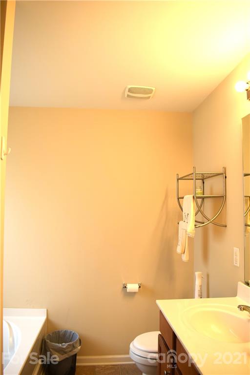 12021 Bending Branch Road Charlotte, NC 28227 - Photo 13 of 16 a bathroom with a granite countertop sink and a mirror