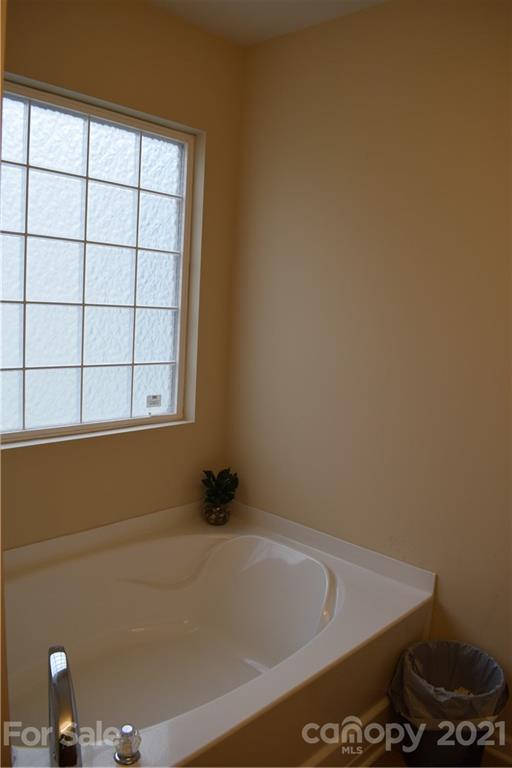 12021 Bending Branch Road Charlotte, NC 28227 - Photo 14 of 16 a bathroom with a bathtub