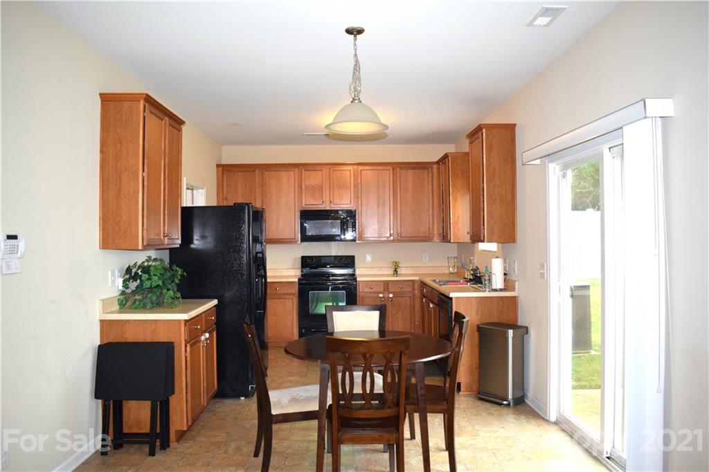 12021 Bending Branch Road Charlotte, NC 28227 - Photo 5 of 16 a dining room with furniture and window