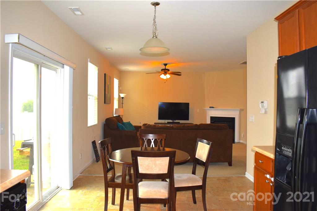 12021 Bending Branch Road Charlotte, NC 28227 - Photo 6 of 16 a view of a dining room with furniture window and wooden floor