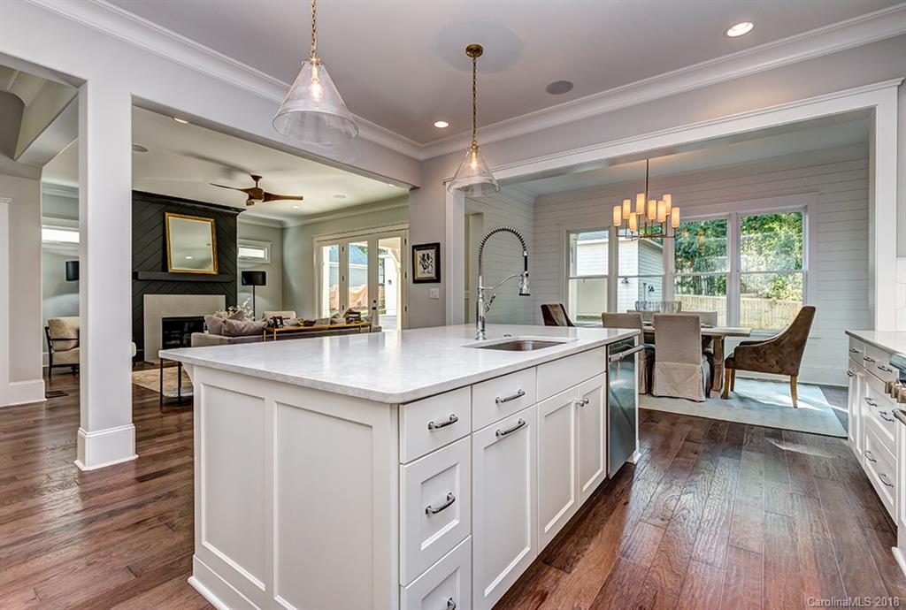 736 Ellsworth Road, Unit 44 Charlotte, NC 28211 - Photo 13 of 36 a kitchen with center island and stainless steel appliances