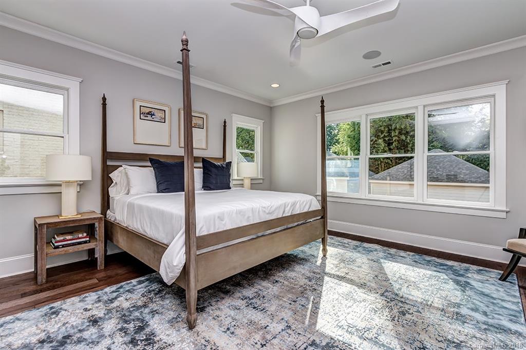 736 Ellsworth Road, Unit 44 Charlotte, NC 28211 - Photo 18 of 36 a bedroom with a bed and a window