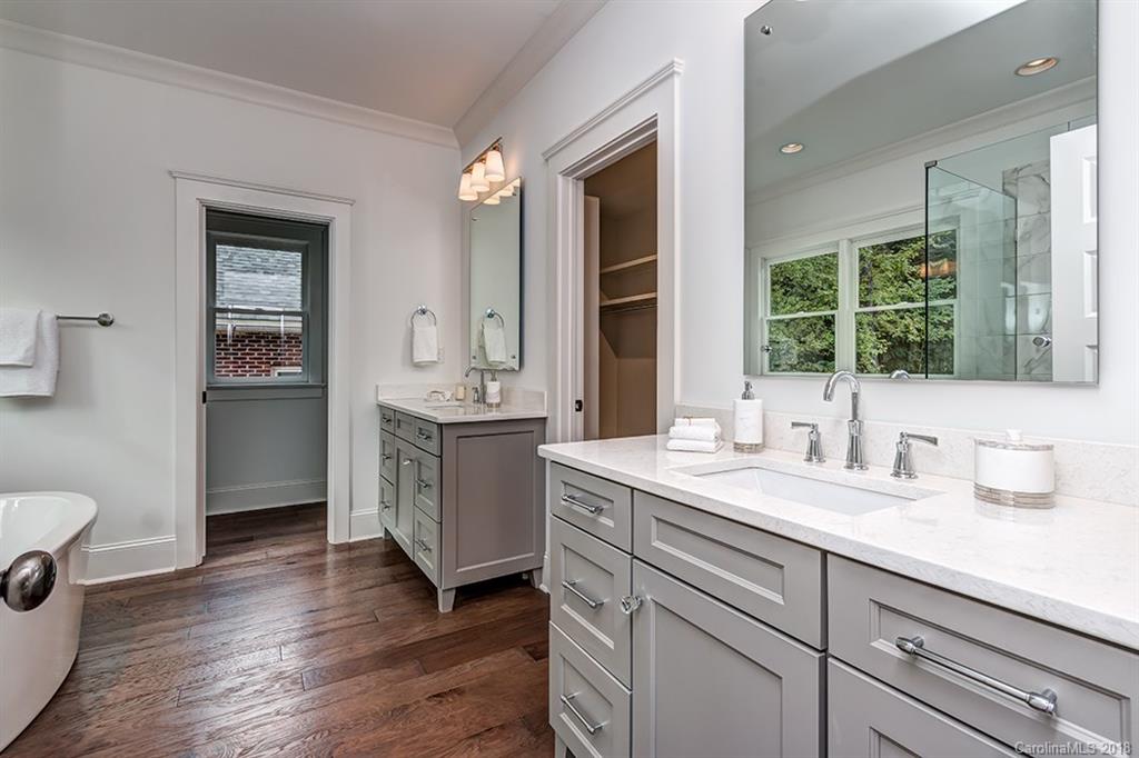 736 Ellsworth Road, Unit 44 Charlotte, NC 28211 - Photo 21 of 36 a spacious bathroom with a granite countertop sink mirror and toilet
