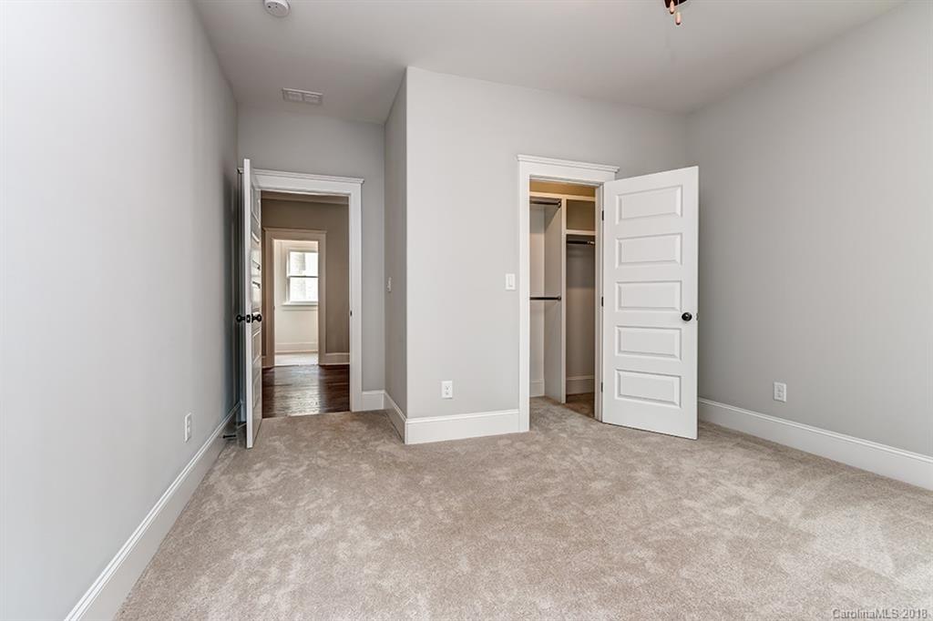 736 Ellsworth Road, Unit 44 Charlotte, NC 28211 - Photo 24 of 36 an empty room with closet and windows