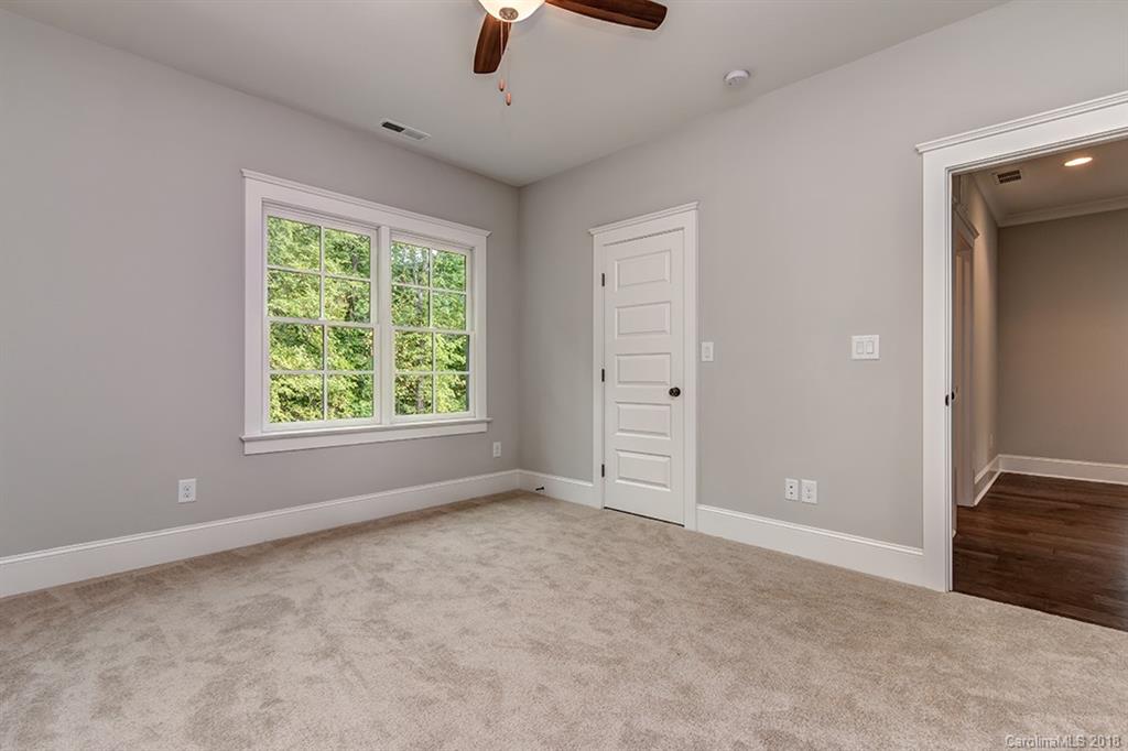 736 Ellsworth Road, Unit 44 Charlotte, NC 28211 - Photo 25 of 36 an empty room with windows and closet