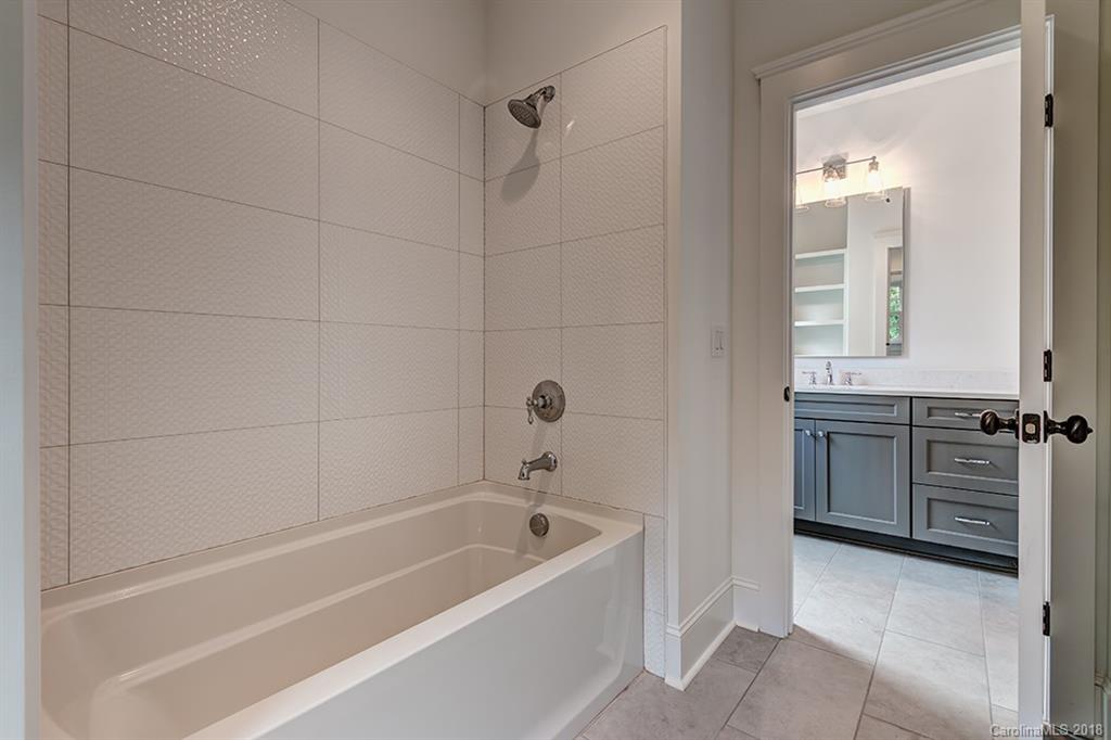 736 Ellsworth Road, Unit 44 Charlotte, NC 28211 - Photo 27 of 36 a bathroom with a bathtub and a shower