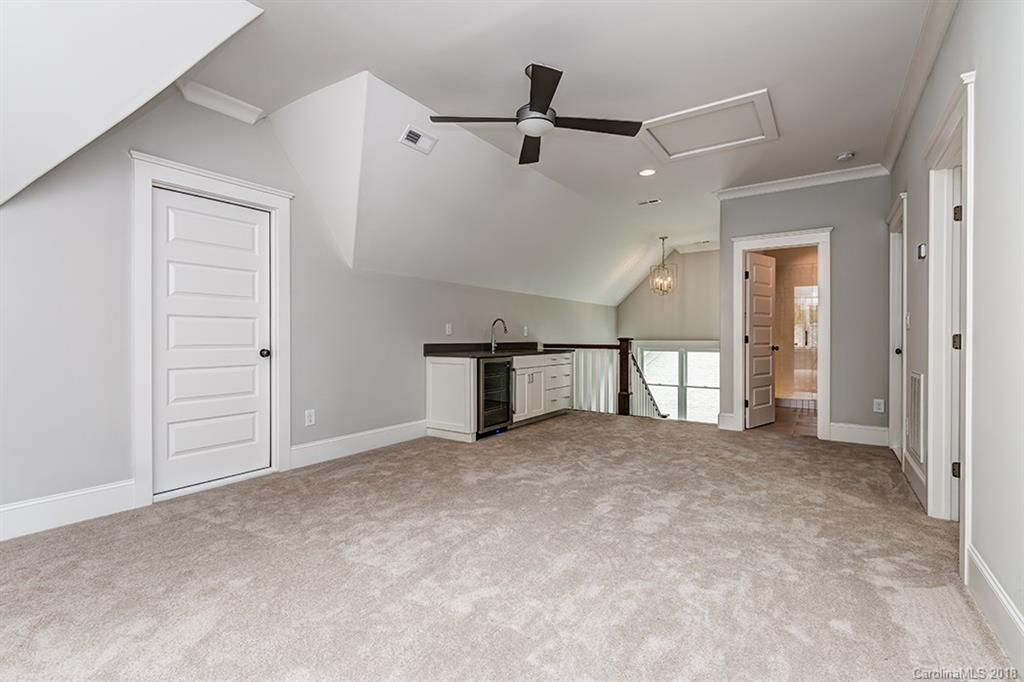 736 Ellsworth Road, Unit 44 Charlotte, NC 28211 - Photo 28 of 36 an empty room with closet and windows