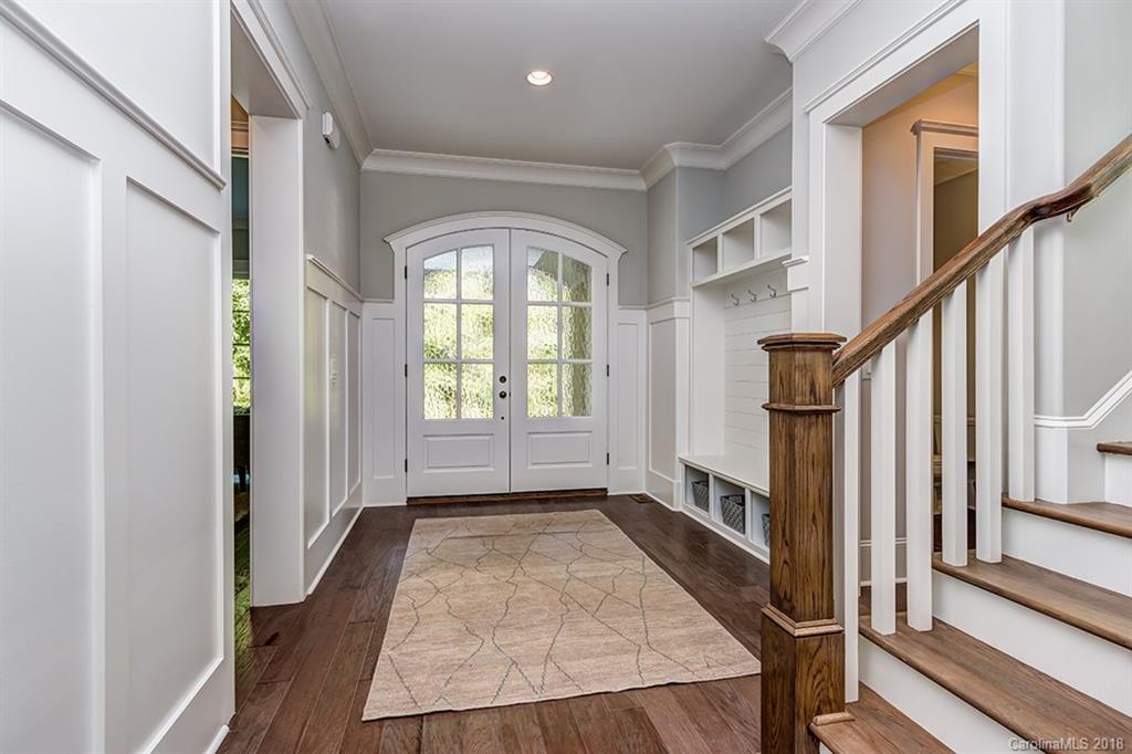 736 Ellsworth Road, Unit 44 Charlotte, NC 28211 - Photo 4 of 36 a view of an entryway with wooden floor and door