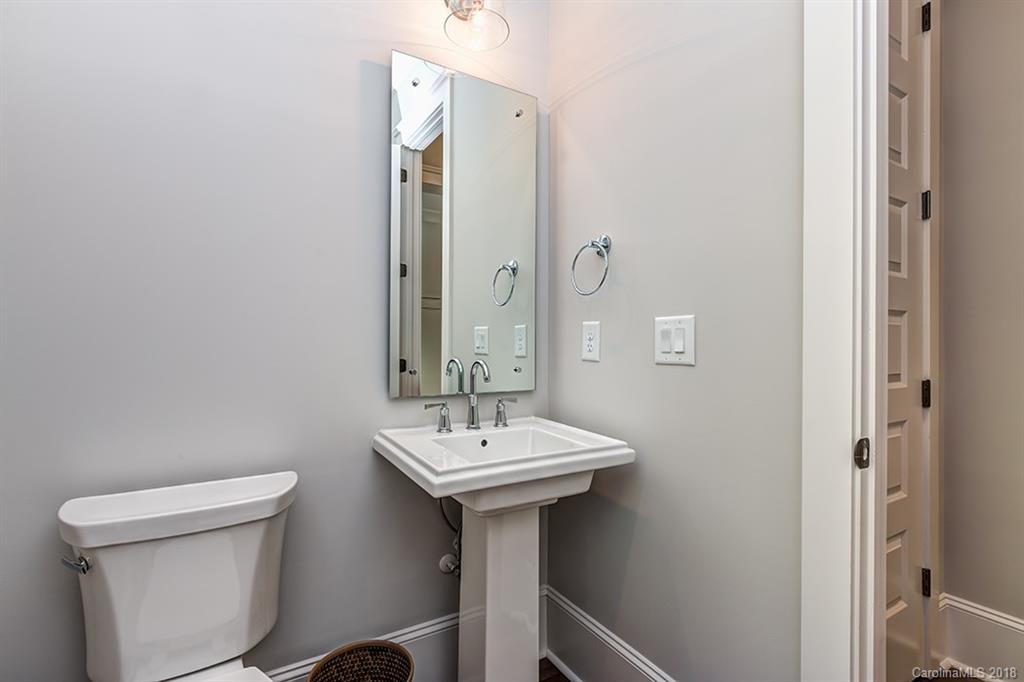 736 Ellsworth Road, Unit 44 Charlotte, NC 28211 - Photo 7 of 36 a bathroom with a sink a toilet and a mirror