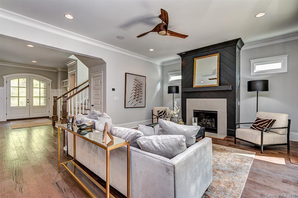 736 Ellsworth Road, Unit 44 Charlotte, NC 28211 - Photo 8 of 36 a living room with furniture and a fireplace