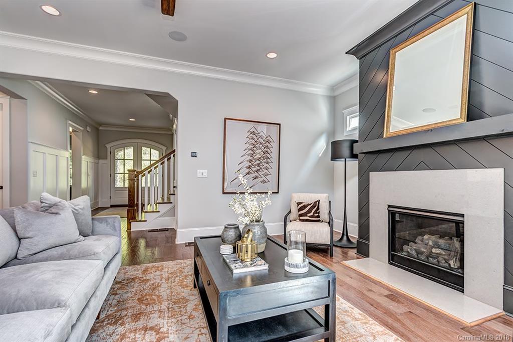 736 Ellsworth Road, Unit 44 Charlotte, NC 28211 - Photo 10 of 36 a living room with furniture and a fireplace