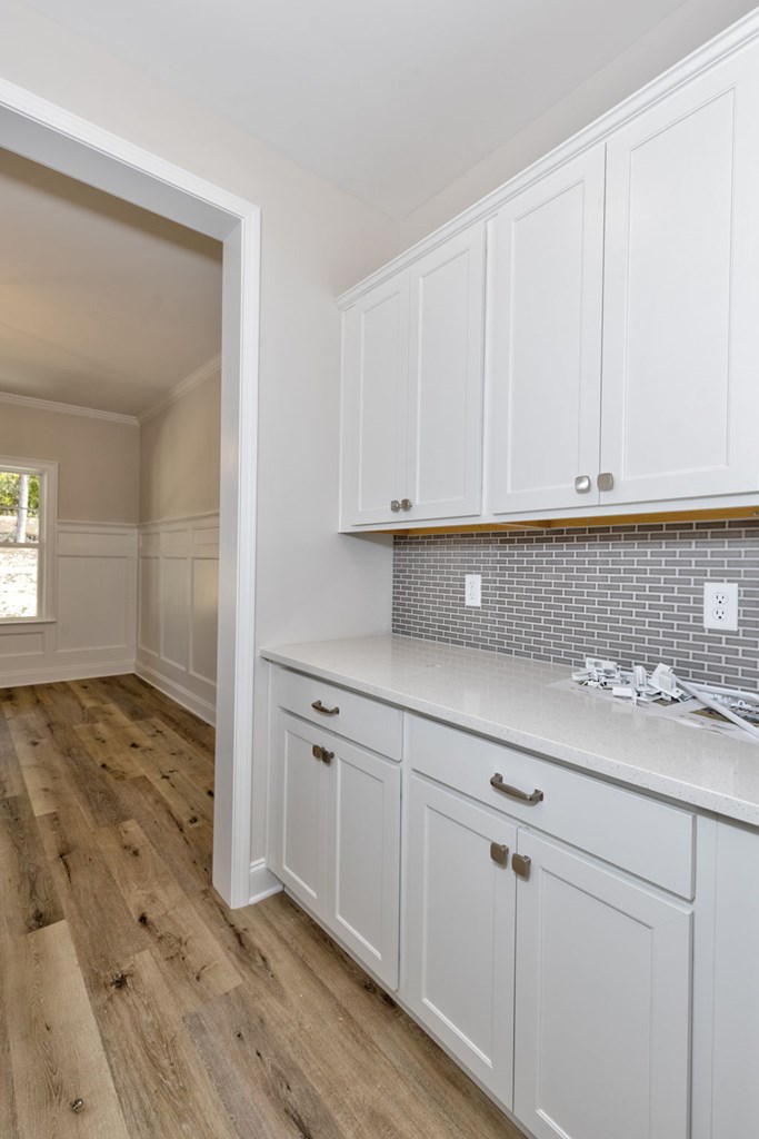 8701 McKee Road Upatoi, GA 31829 - Photo 14 of 35 a kitchen with stainless steel appliances granite countertop a sink and cabinets with wooden floor