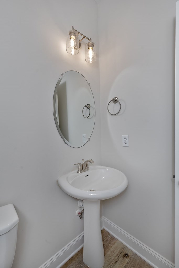 8701 McKee Road Upatoi, GA 31829 - Photo 15 of 35 a bathroom with a sink and a mirror