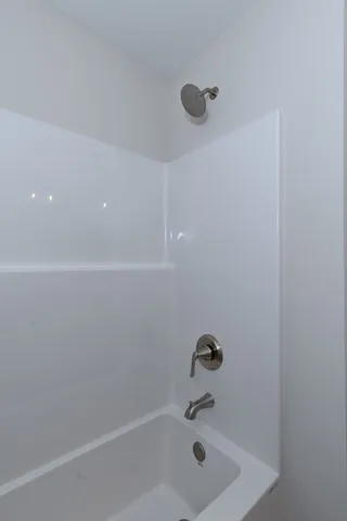 a spacious bathroom with a double vanity sink mirror and double