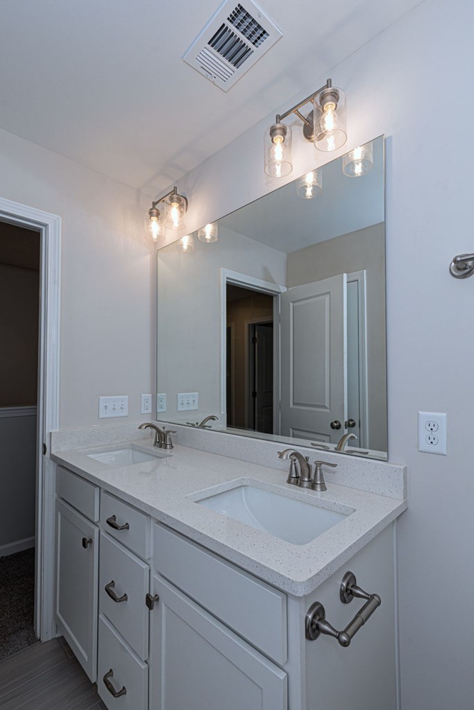 8701 McKee Road Upatoi, GA 31829 - Photo 18 of 35 a bathroom with a sink double vanity and a mirror