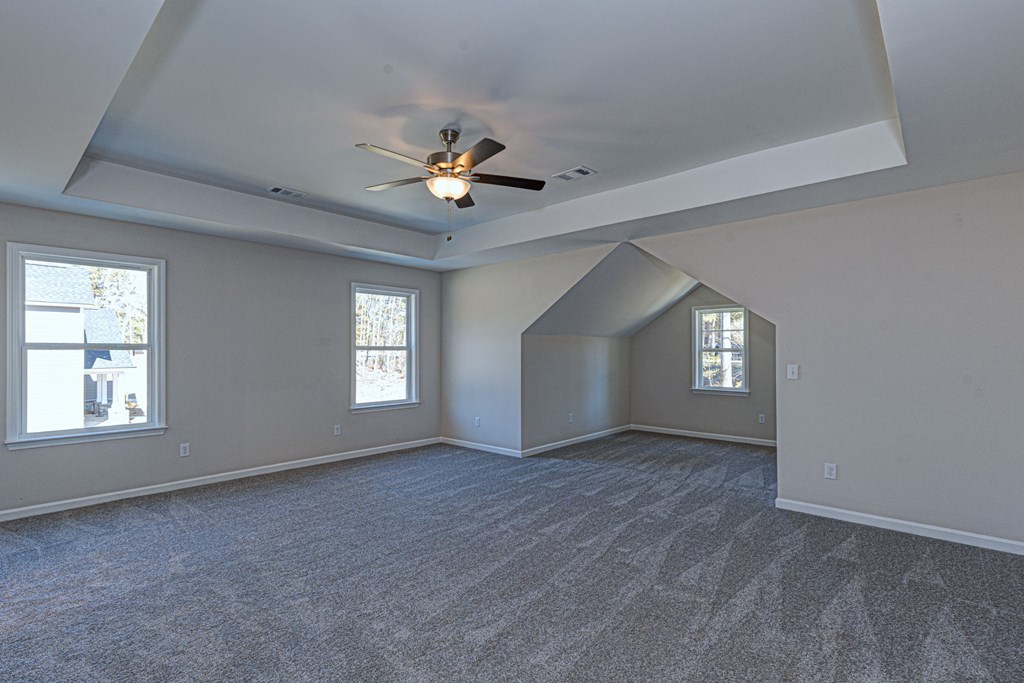 8701 McKee Road Upatoi, GA 31829 - Photo 19 of 35 wooden floor in an empty room with a window