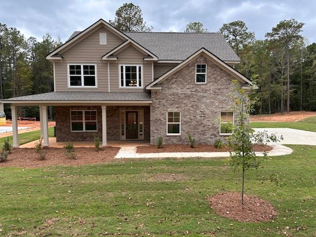 8701 McKee Road Upatoi, GA 31829 - Photo 2 of 35 a front view of a house with a yard