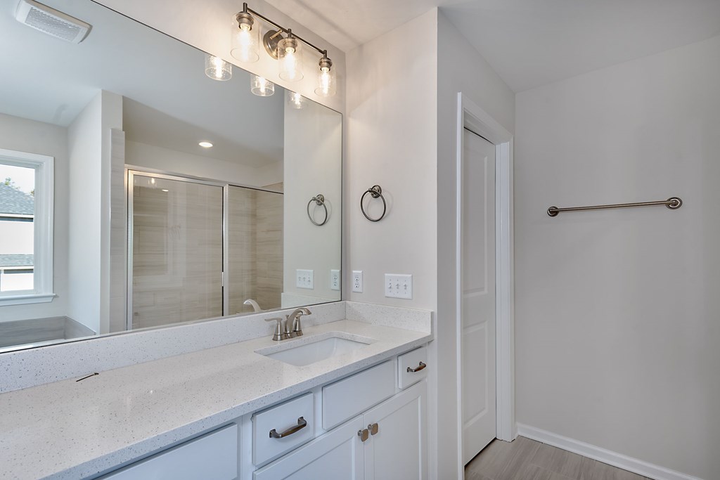 8701 McKee Road Upatoi, GA 31829 - Photo 24 of 35 a bathroom with a sink and a mirror