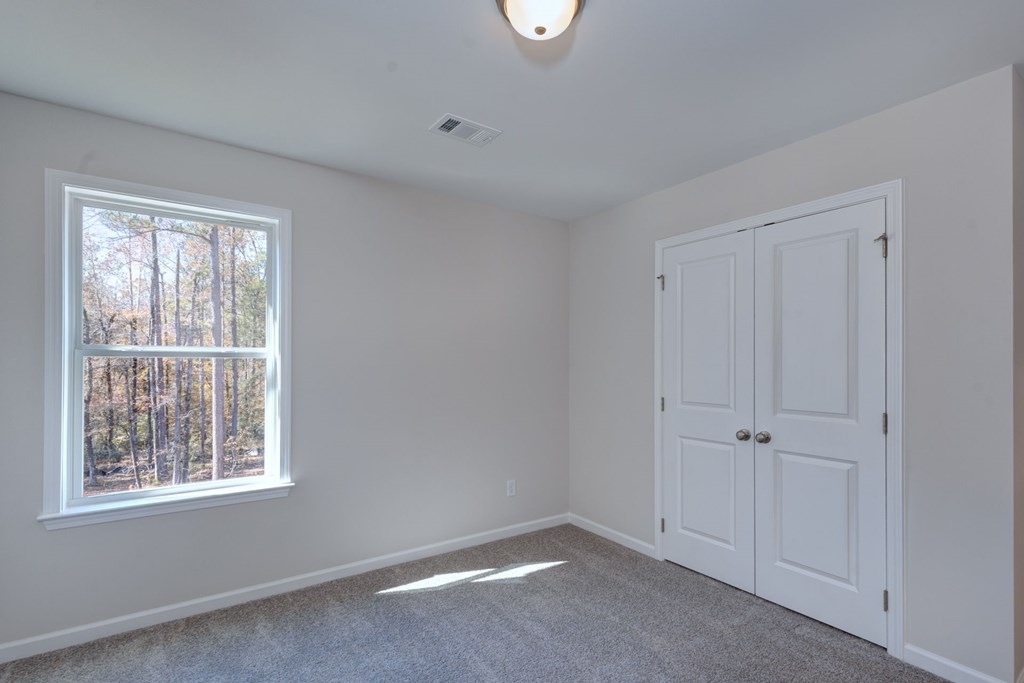 8701 McKee Road Upatoi, GA 31829 - Photo 28 of 35 an empty room with windows