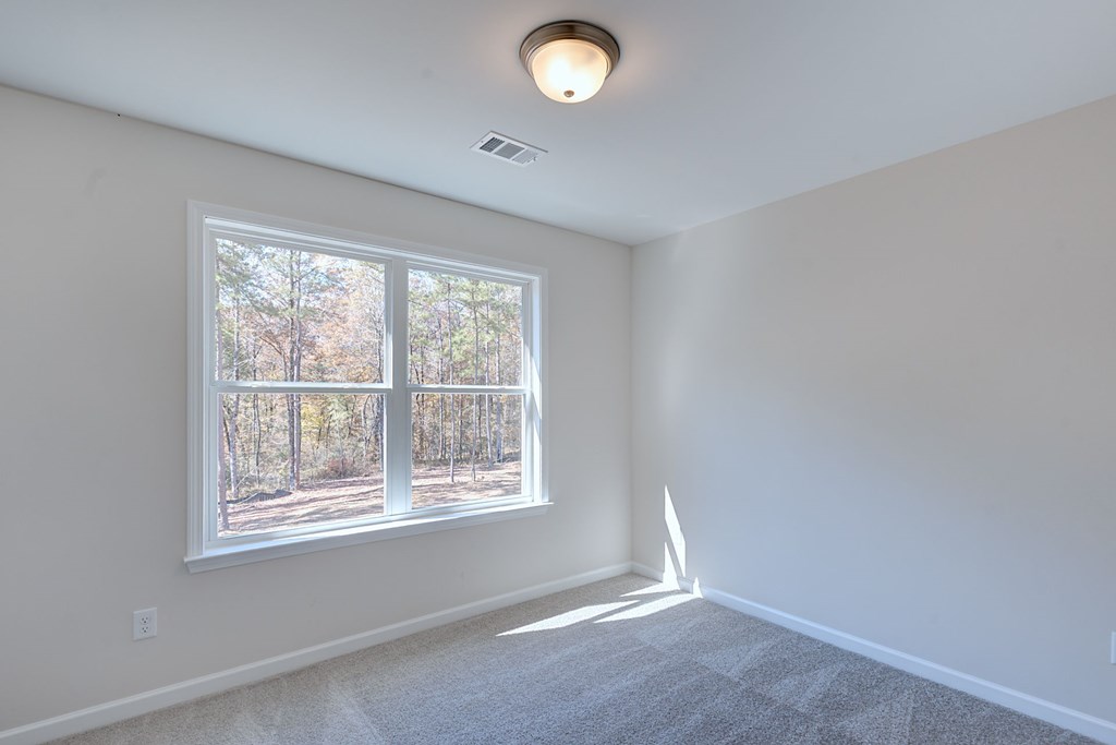 8701 McKee Road Upatoi, GA 31829 - Photo 31 of 35 an empty room with a window