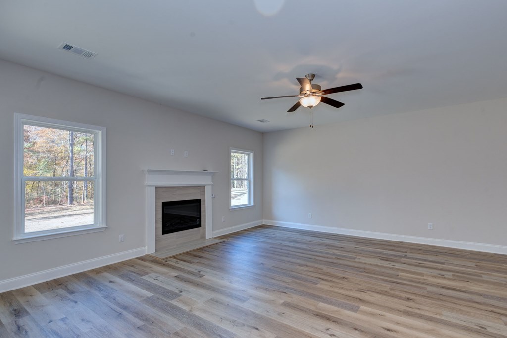 8701 McKee Road Upatoi, GA 31829 - Photo 4 of 35 an empty room with fan and windows