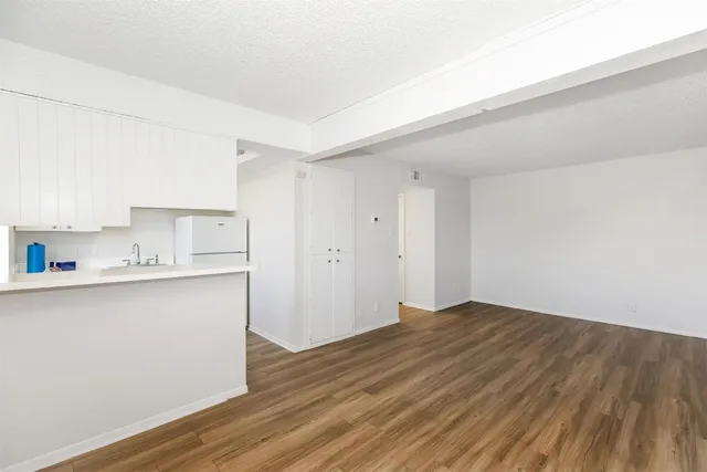 a view of kitchen with wooden floor