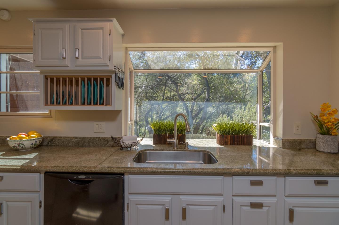 14795 Bohlman Road Saratoga, CA 95070 - Photo 15 of 50 a kitchen with granite countertop a sink and a white cabinets