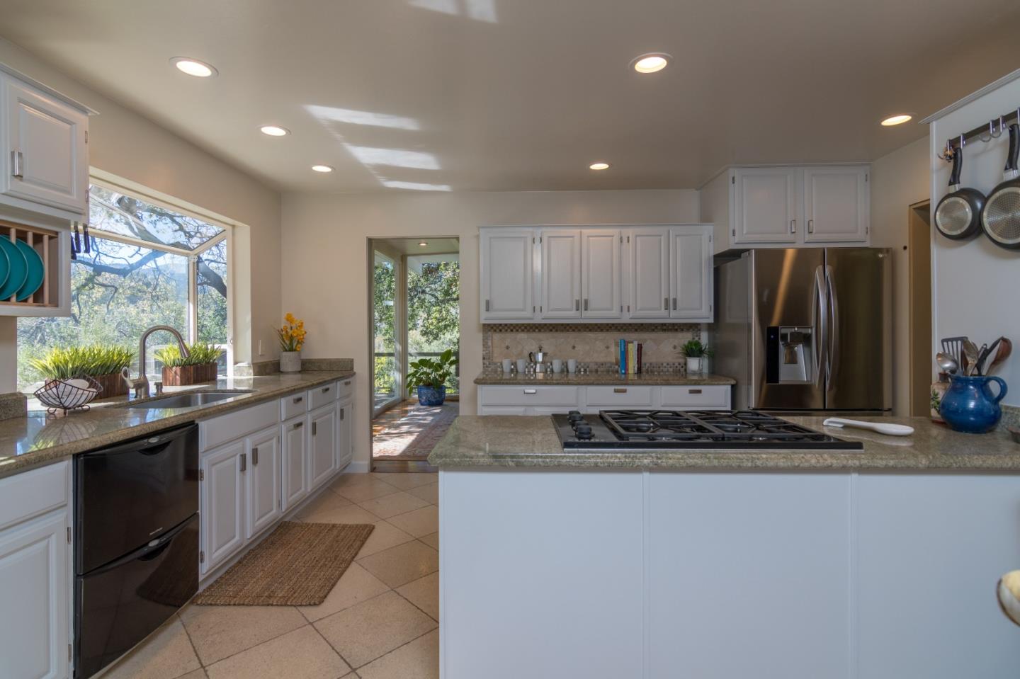 14795 Bohlman Road Saratoga, CA 95070 - Photo 17 of 50 a kitchen with stainless steel appliances granite countertop a sink stove and refrigerator