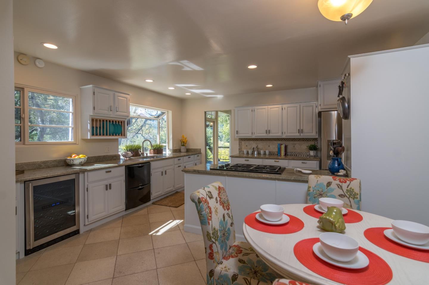 14795 Bohlman Road Saratoga, CA 95070 - Photo 18 of 50 a kitchen with stainless steel appliances granite countertop a sink and a stove