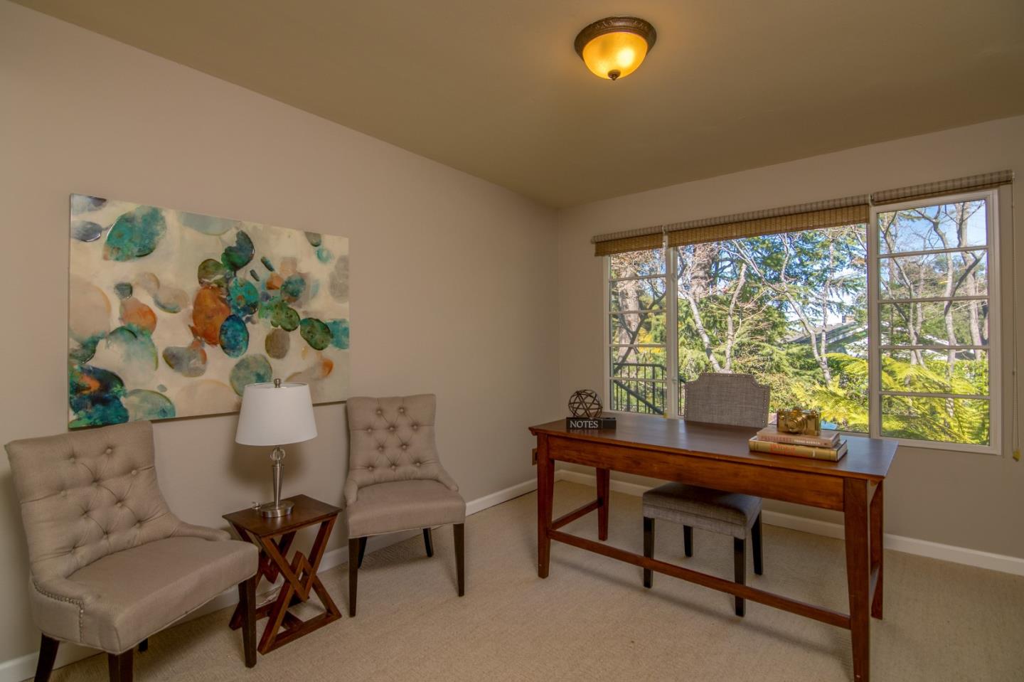 14795 Bohlman Road Saratoga, CA 95070 - Photo 24 of 50 a view of a workspace with furniture and a potted plant