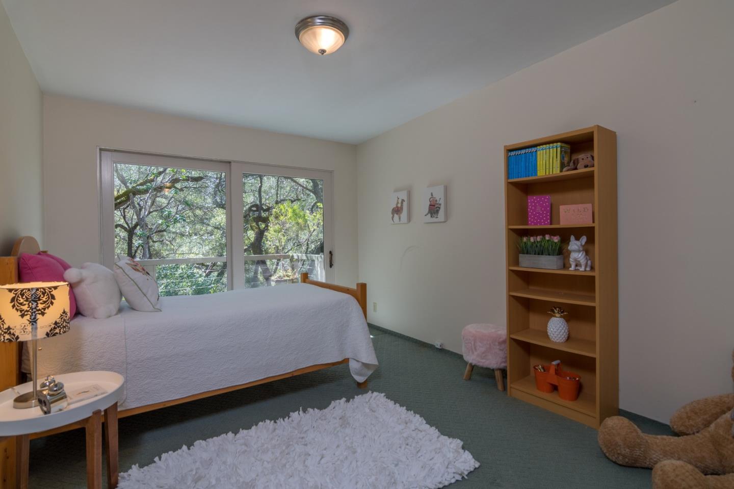 14795 Bohlman Road Saratoga, CA 95070 - Photo 26 of 50 a bedroom with a bed and a window