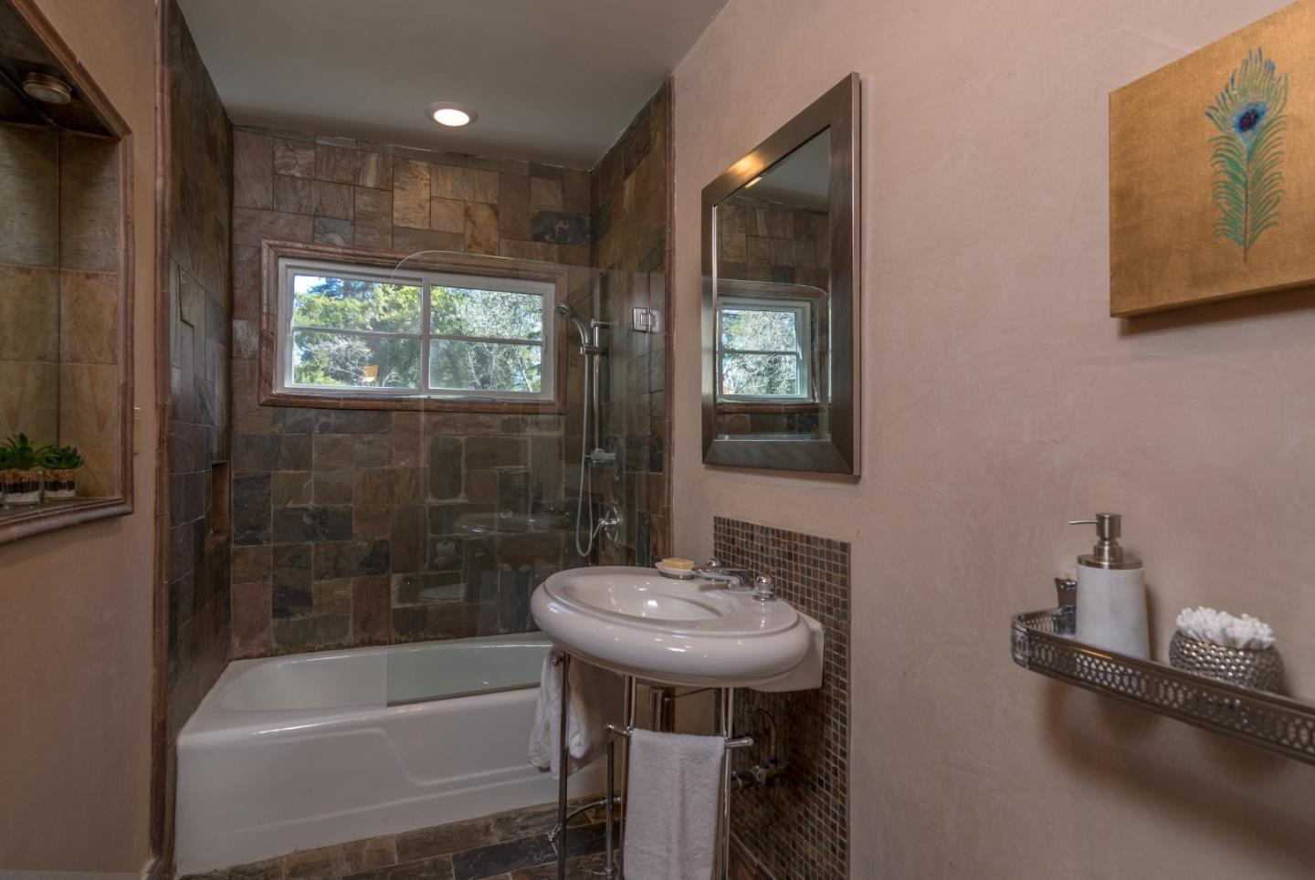 14795 Bohlman Road Saratoga, CA 95070 - Photo 28 of 50 a bathroom with a sink a toilet and shower