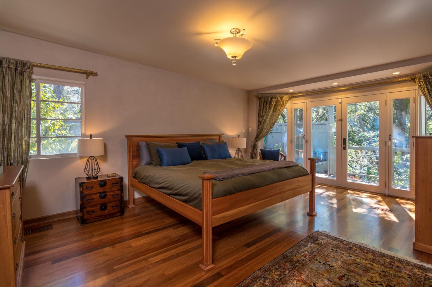 14795 Bohlman Road Saratoga, CA 95070 - Photo 29 of 50 a bedroom with a bed and wooden floor